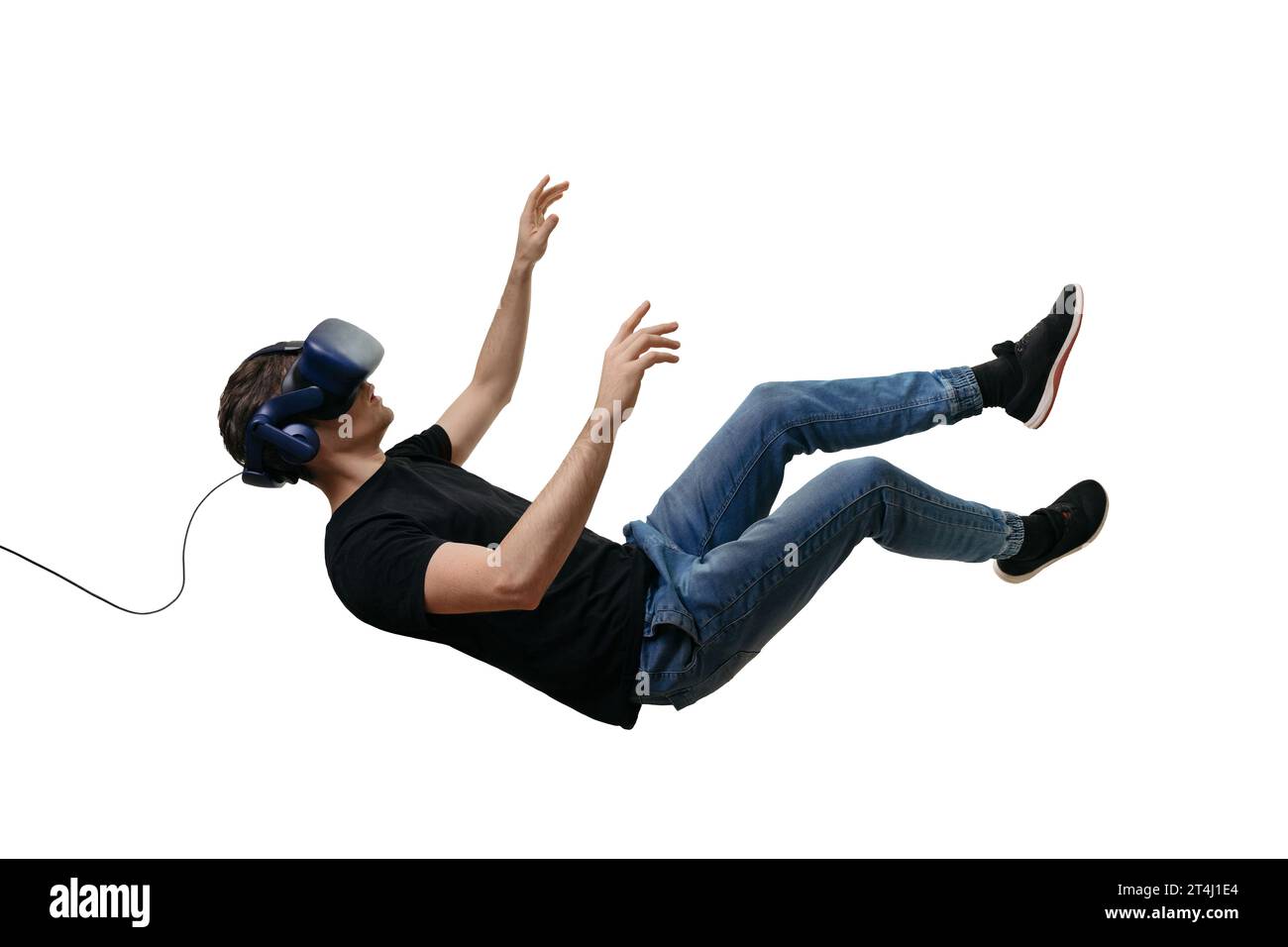 Isolated young men falling in zero gravity space while using virtual reality glasses on white background. 3d simulation headset Stock Photo