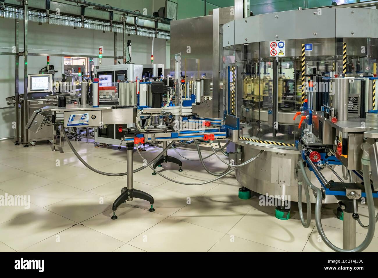 Cooking Factory Cooking oil or Sunflower oil in the bottle moving on production line ...