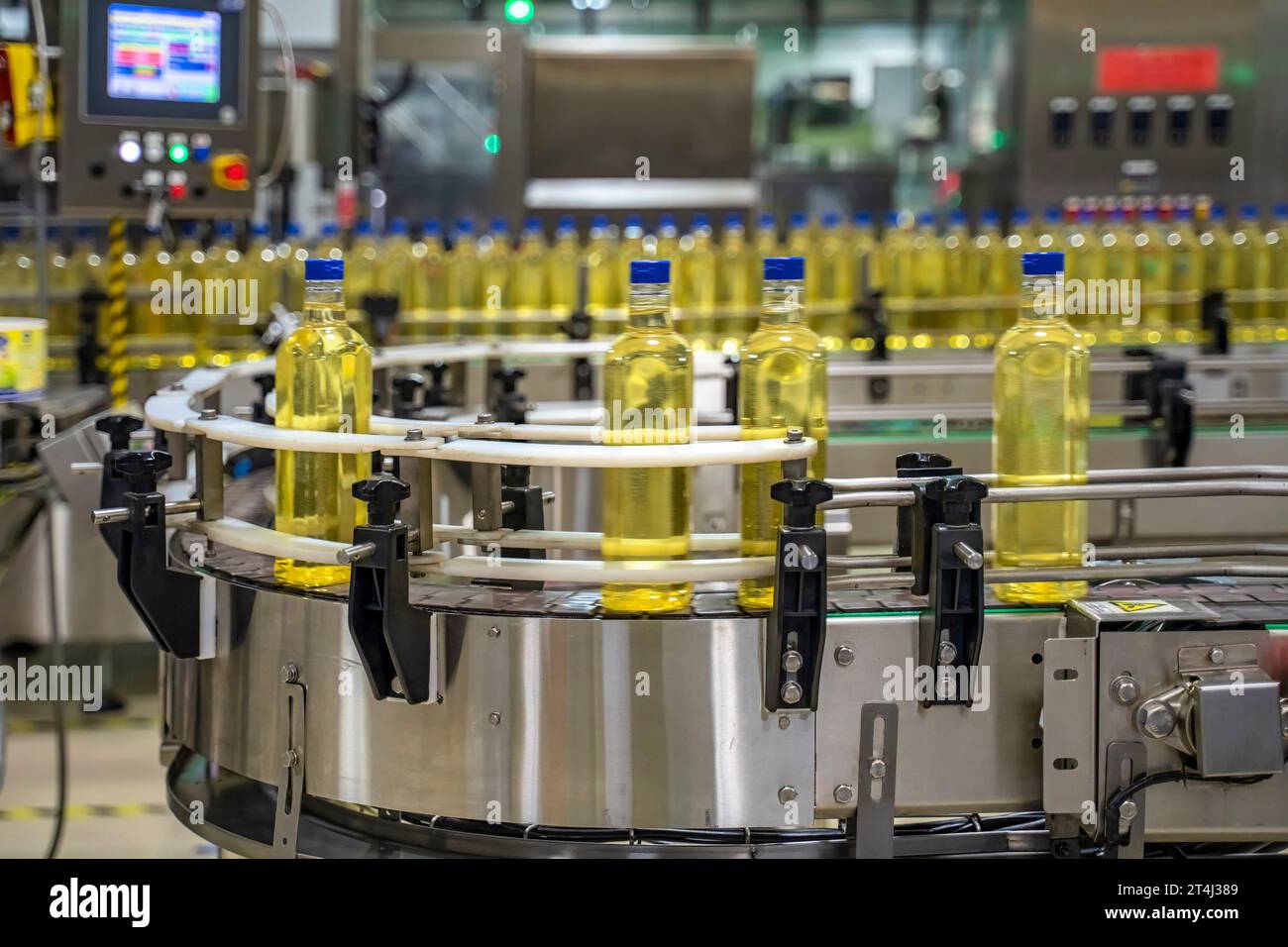 Cooking Factory Cooking oil or Sunflower oil in the bottle moving on production line ...