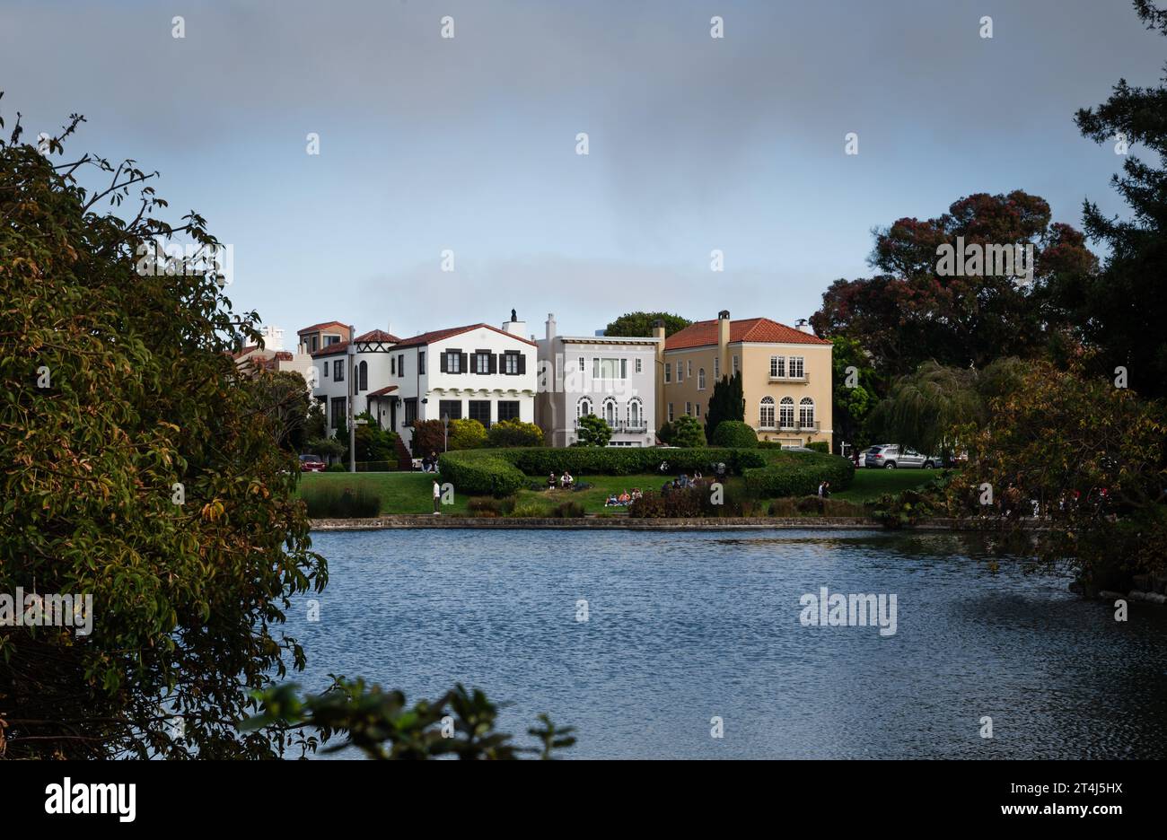 View of houses from across the pond at Palace of Fine Arts Stock Photo