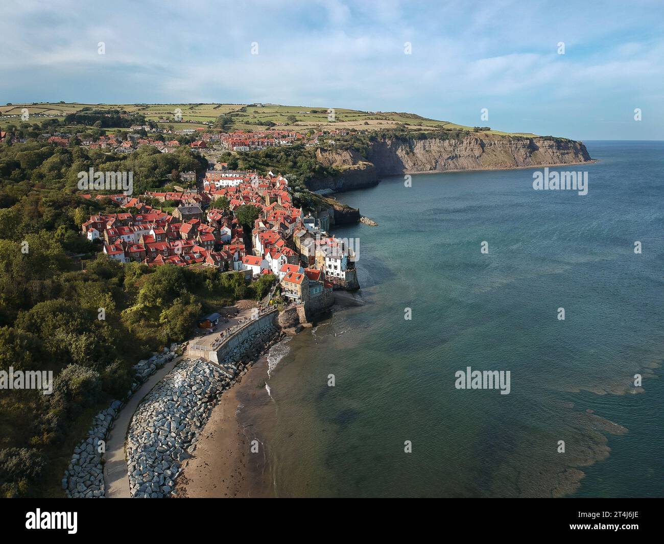 an-aerial-view-of-a-small-beach-town-situated-on-the-coastline-in-robin