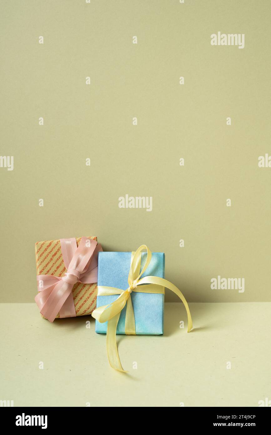 Two gift boxes on table. khaki beige background Stock Photo