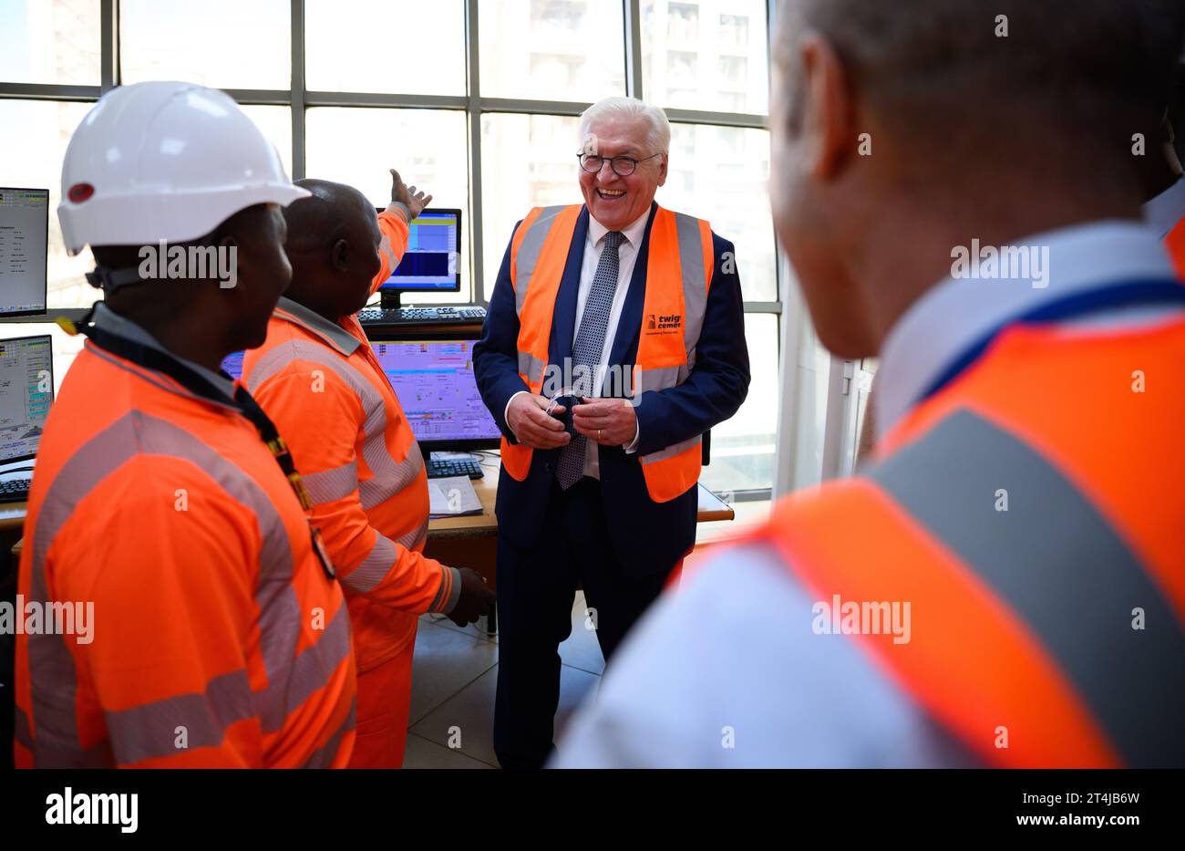 Daressalam, Tanzania. 31st Oct, 2023. German President Frank-Walter Steinmeier visits a production site of Twiga Cement, a subsidiary of Heidelberg Materials, and has employees in the control room explain the production processes to him. This week, President Steinmeier is visiting the East African countries of Tanzania and Zambia. Credit: Bernd von Jutrczenka/dpa/Alamy Live News Stock Photo