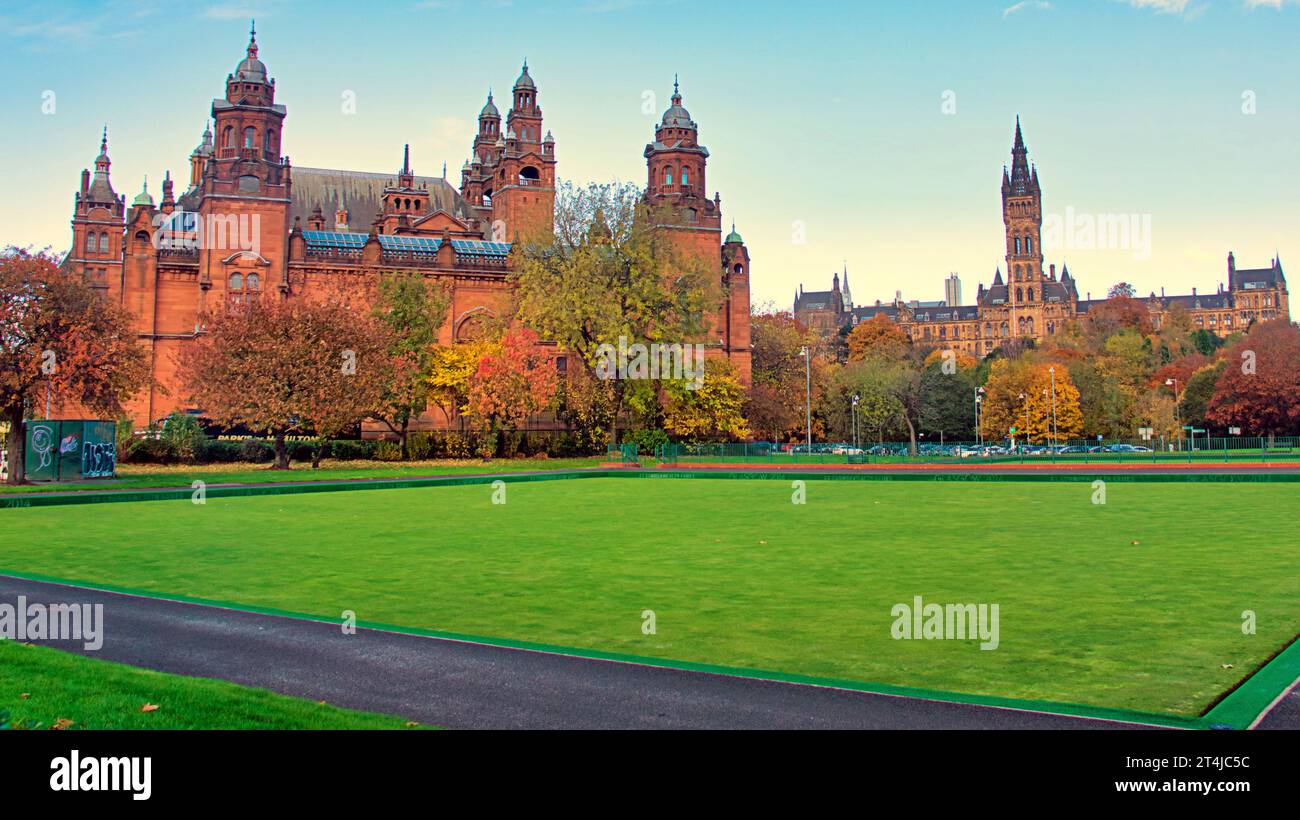 Glasgow, Scotland, UK. 31st October, 2023. UK Weather:  Glasgow museum and art galleries with glasgow university behind the commonwealth games bowling green.  Sunny fine autumns day saw a wealth of colour in kelvingrove park for halloween  . Credit Gerard Ferry/Alamy Live News Stock Photo