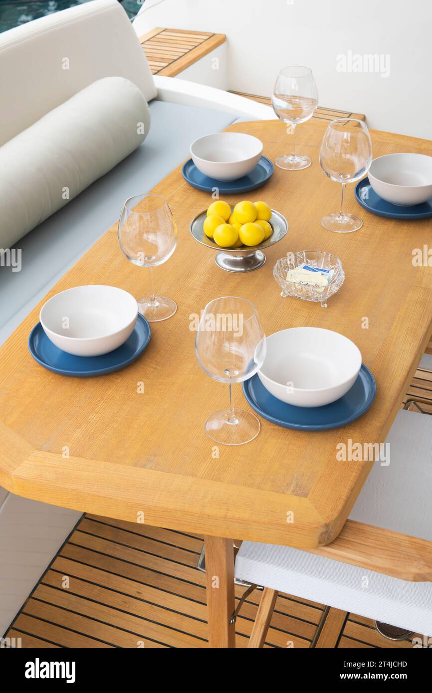 Dining table set for lunch on a luxury yacht deck Stock Photo