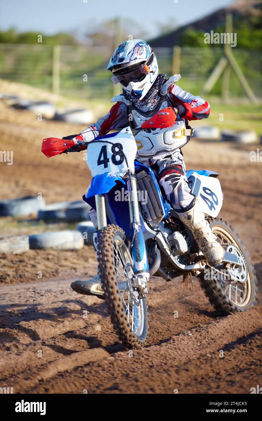 Person, motorcycle and dirt race track adventure as .professional in