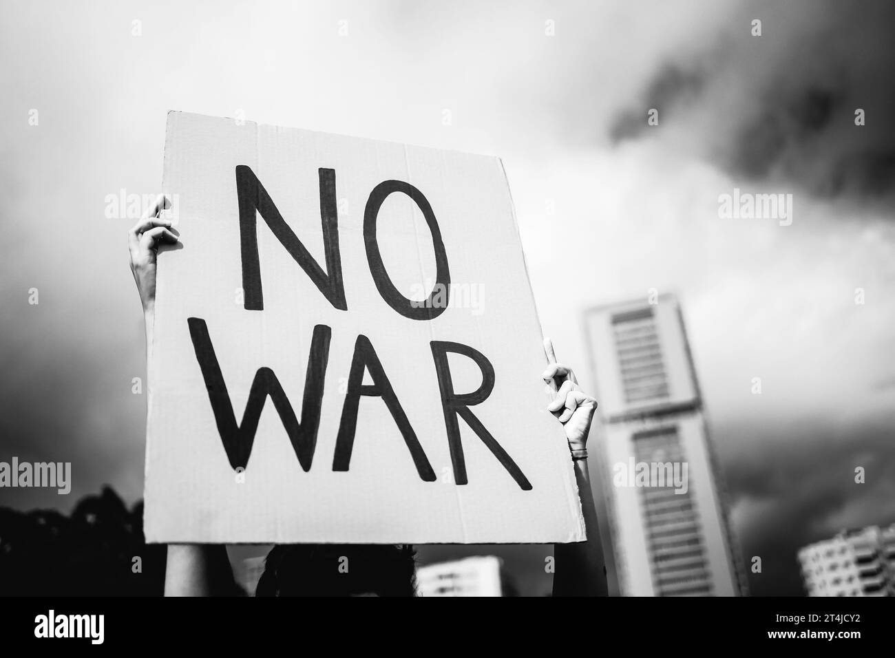 Stop war protest. Woman in crowd fighting against Israel and Palestine conflict. Black and white editing Stock Photo