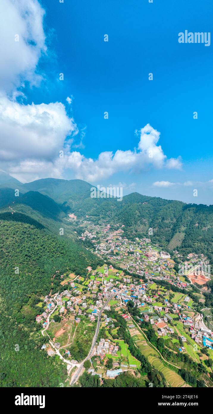 Aerial view of Kathmandu valley, temple on the hills. The monastery is surrounded by lush green hills. Rinpoche Statue, Asura Cave, Old Dashinkali Stock Photo