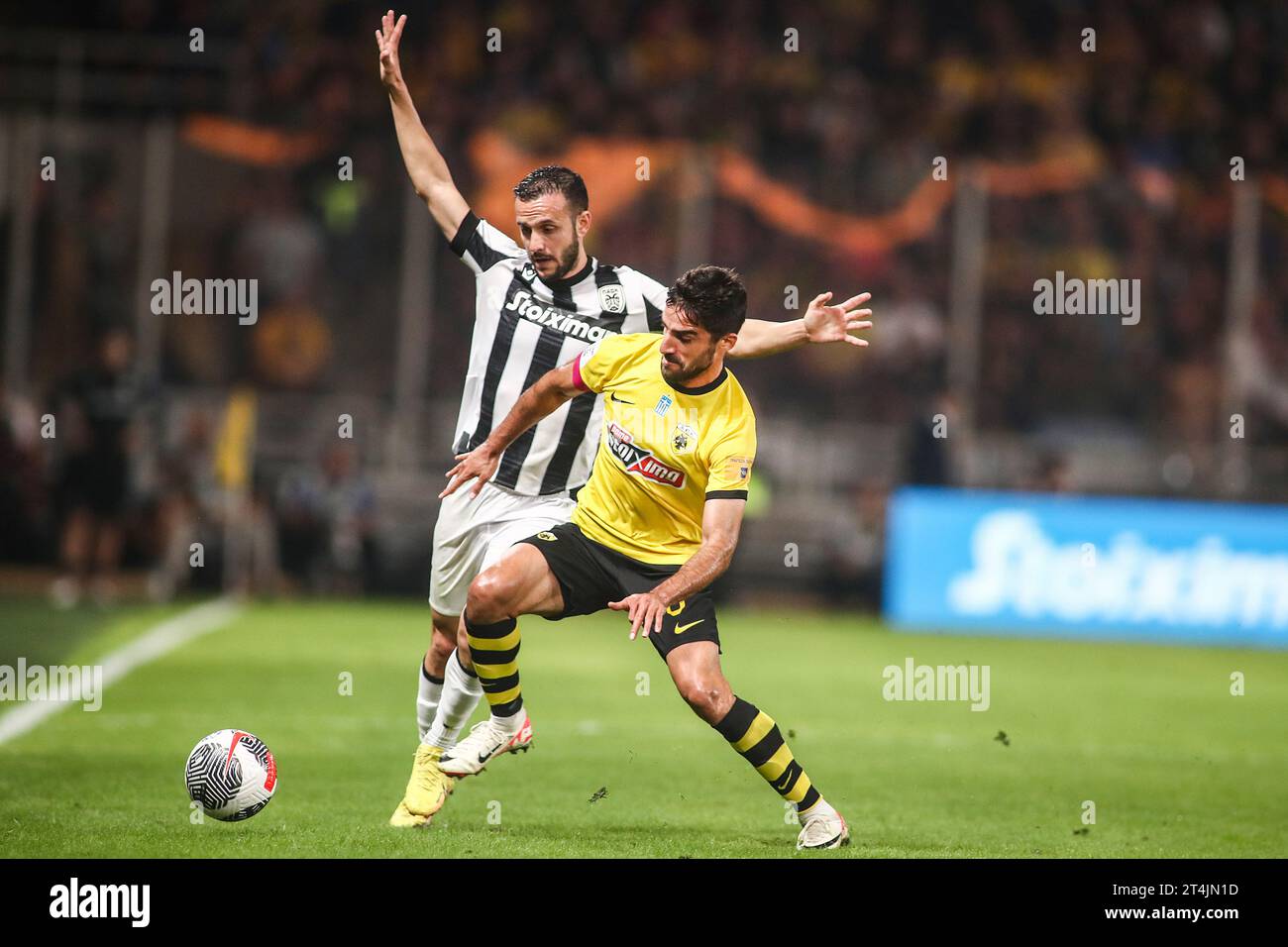 Athens, Greece. 30th Oct, 2023. AEK's Milad Mohammadi (Right) and PAOK's Joan Sastre (Left) fight for the ball during a Greek Superleague match between AEK FC and PAOK FC. (Credit Image: © Giannis Papanikos/ZUMA Press Wire) EDITORIAL USAGE ONLY! Not for Commercial USAGE! Stock Photo