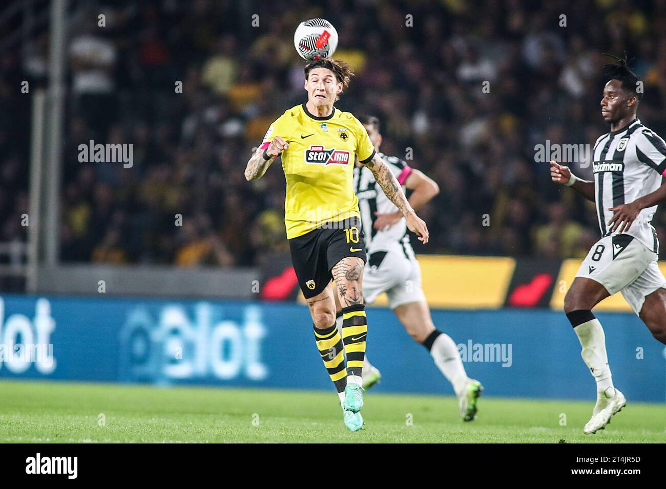 Athens, Greece. 30th Oct, 2023. AEK's Steven Zuber takes a header during a Greek Superleague match between AEK FC and PAOK FC. (Credit Image: © Giannis Papanikos/ZUMA Press Wire) EDITORIAL USAGE ONLY! Not for Commercial USAGE! Stock Photo