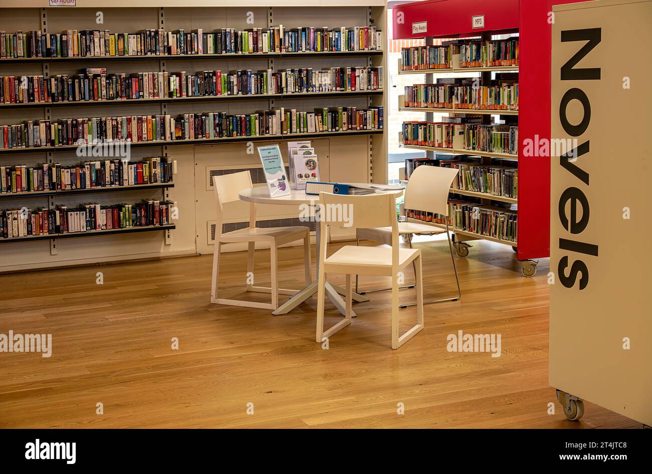 Colourful book shelves in a public library Stock Photo