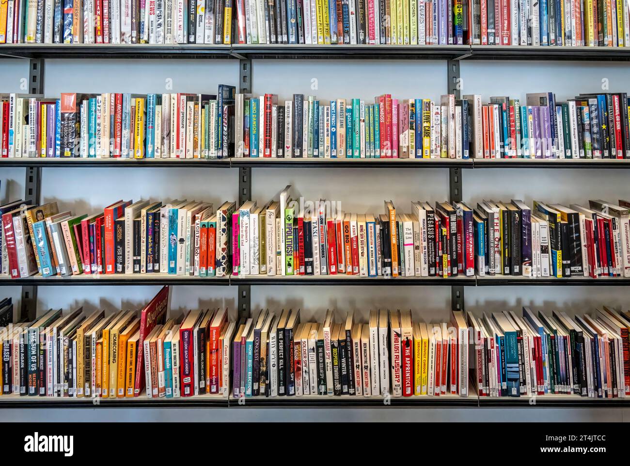 Colourful book shelves in a public library Stock Photo