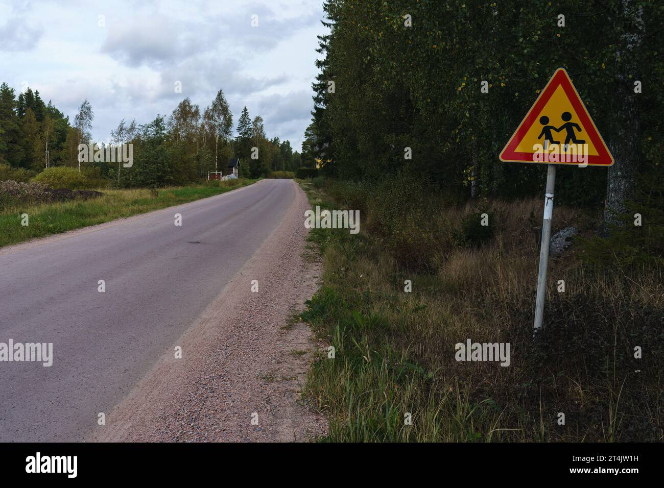 School children warning sign next to countryside road in Finland. Stock Photo