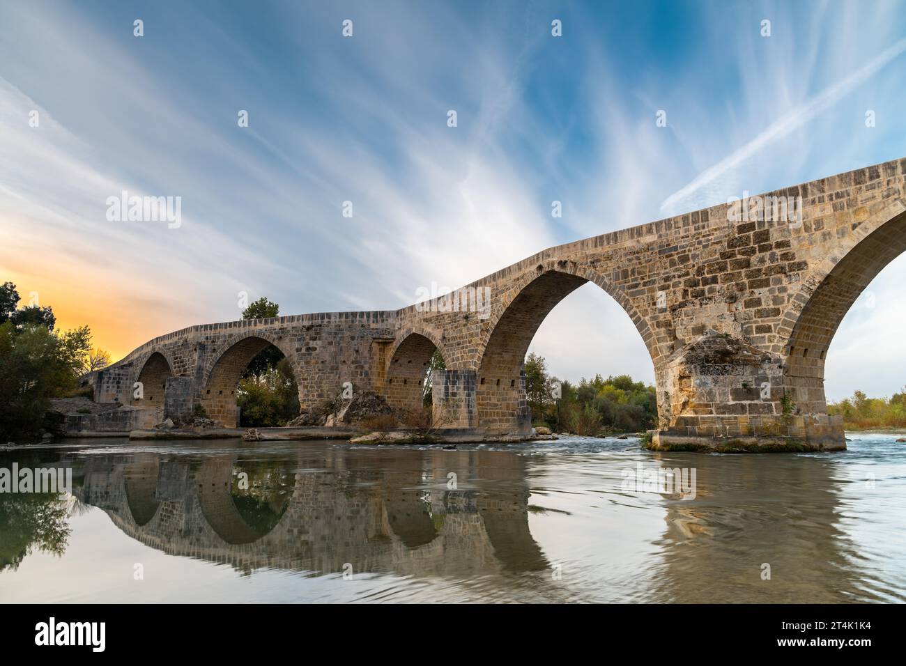 The historical Aspendos Bridge over Koprucay at sunrise in Antalya Turkey Stock Photo