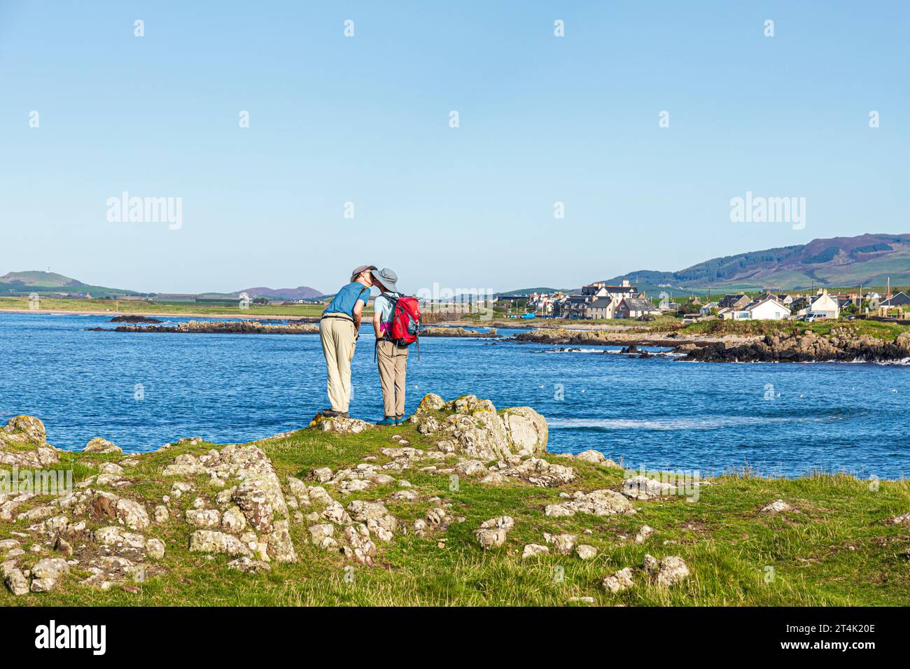 An amorous couple kissing on the coast at Machrihanish on the Kintyre Peninsula, Argyll & Bute, Scotland UK Stock Photo