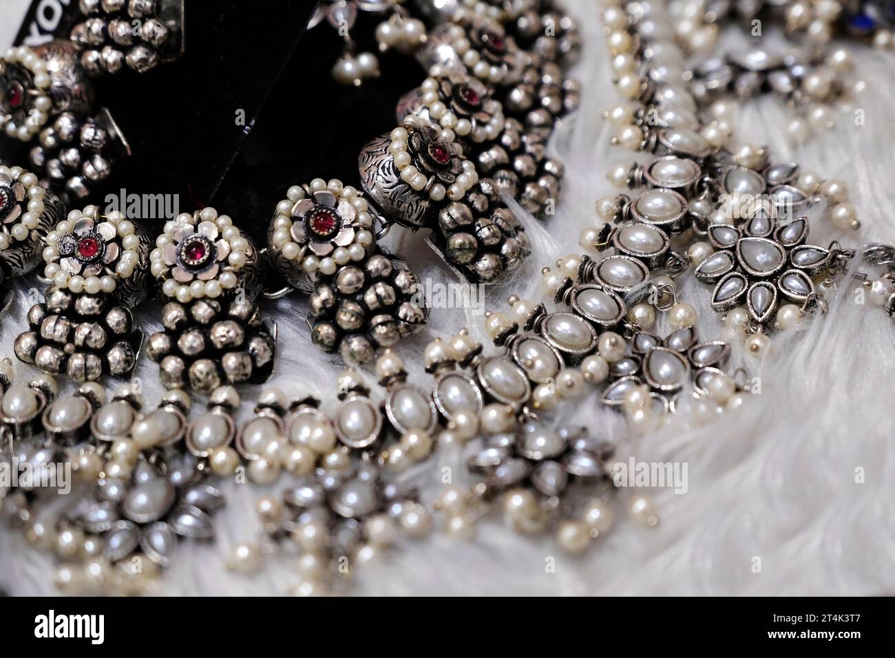 colorful traditional indian jewelry displayed in a street shop for sale