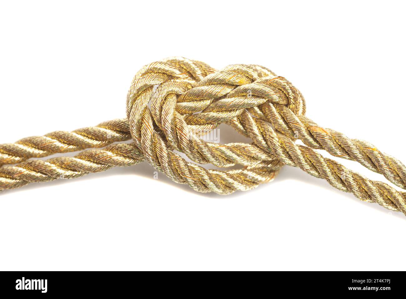 Golden rope tied in a knot isolated on a white background. Stock Photo