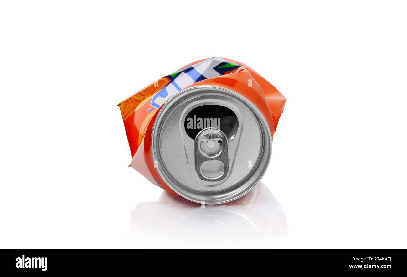 CHISINAU, MOLDOVA - October 27, 2023. Crumpled aluminum can with sweet carbonated drink Fanta isolated on a white background. With clipping path Stock Photo