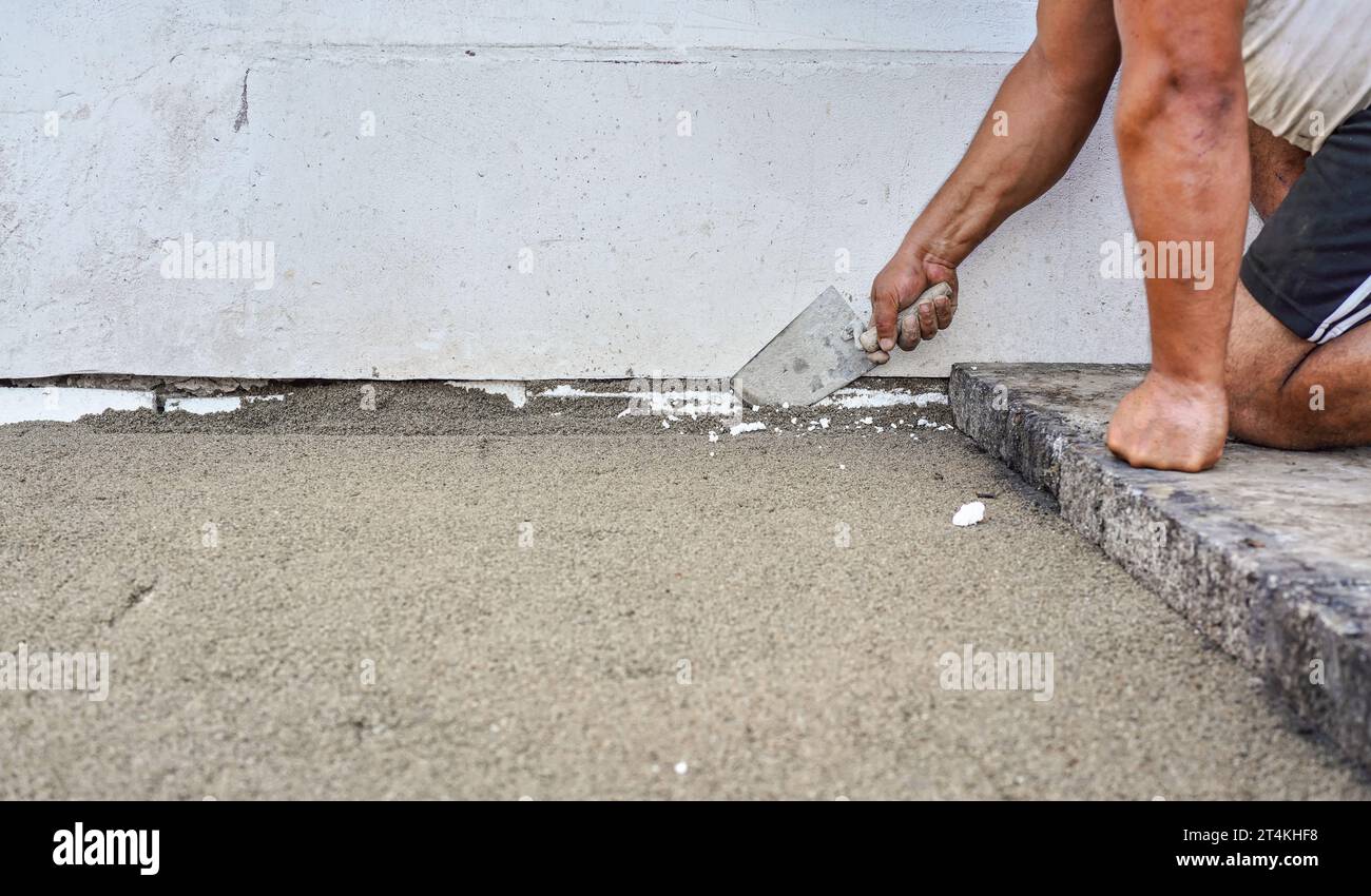 Installing new pavement or floor outside from large concrete tiles