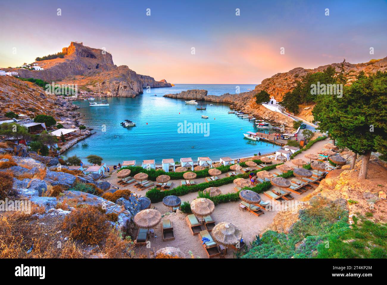 Panoramic view of St. Paul bay with acropolis of Lindos in background ...