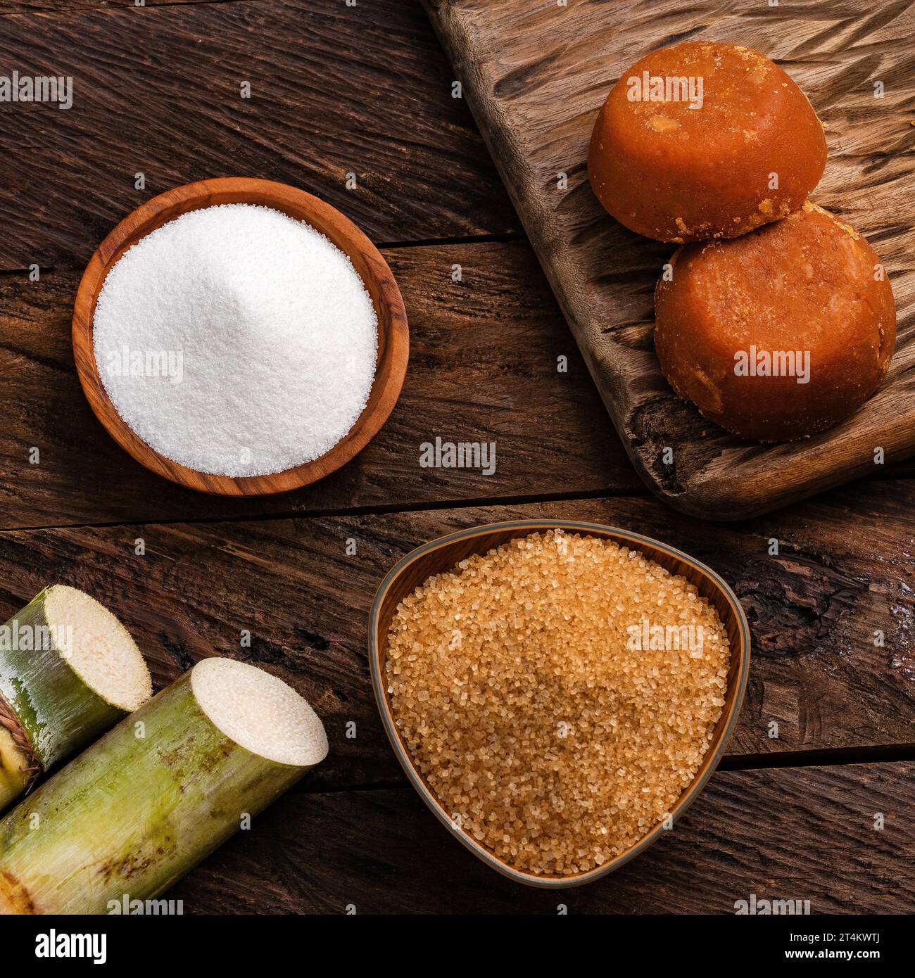 Panela, brown and white sugar with the stems of sugar cane - Saccharum officinarum Stock Photo