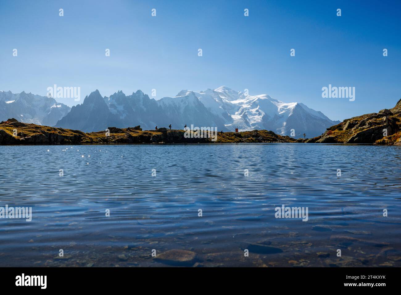 mountain lake Lac Blanc in Chamonix with mountains of the Mont Blanc Massiv in the distance Stock Photo