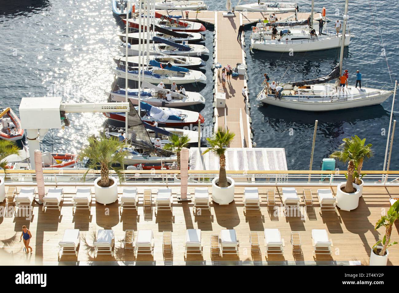 Monaco, Monte-Carlo, 29 September 2022: View from above of a lot of sail boats are moored in the new Yacht Club at sunny day, swim pool on rooftop in Stock Photo