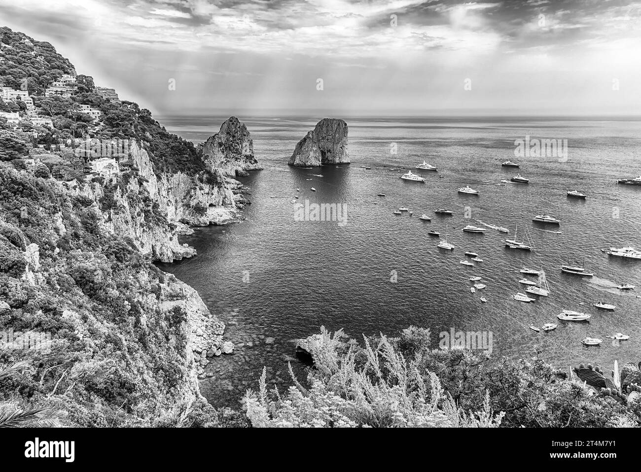Panoramic view over Marina Piccola and Faraglioni: coastal wonders in Mediterranean splendor of the island of Capri, Italy Stock Photo