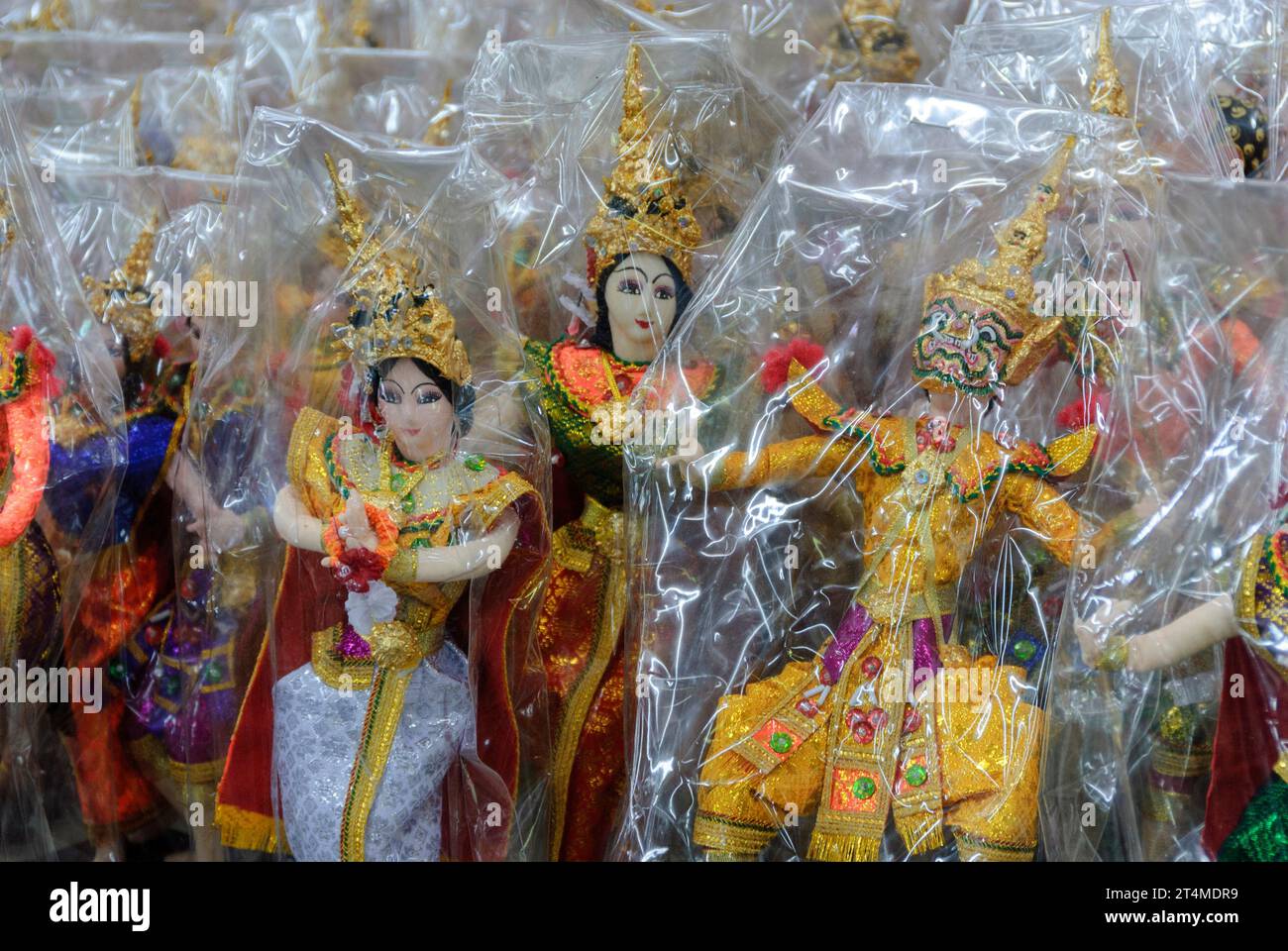Buddha statuettes souvenirs, wrapped in cellophane, sold in local markets for tourists Stock Photo