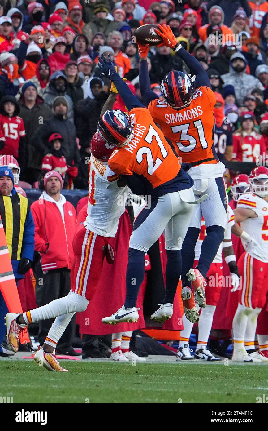 Denver Broncos safety Justin Simmons (31) makes an interception in the
