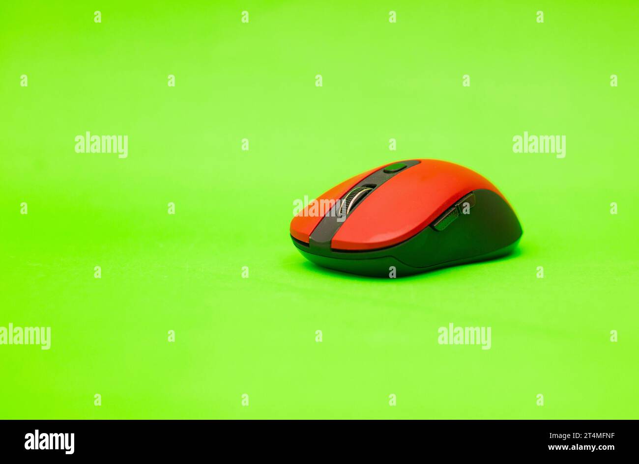 wireless computer mouse isolated on green background Stock Photo