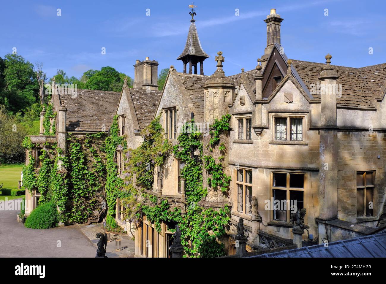 Castle Combe Manor House Hotel with wisteria flowers in early morning