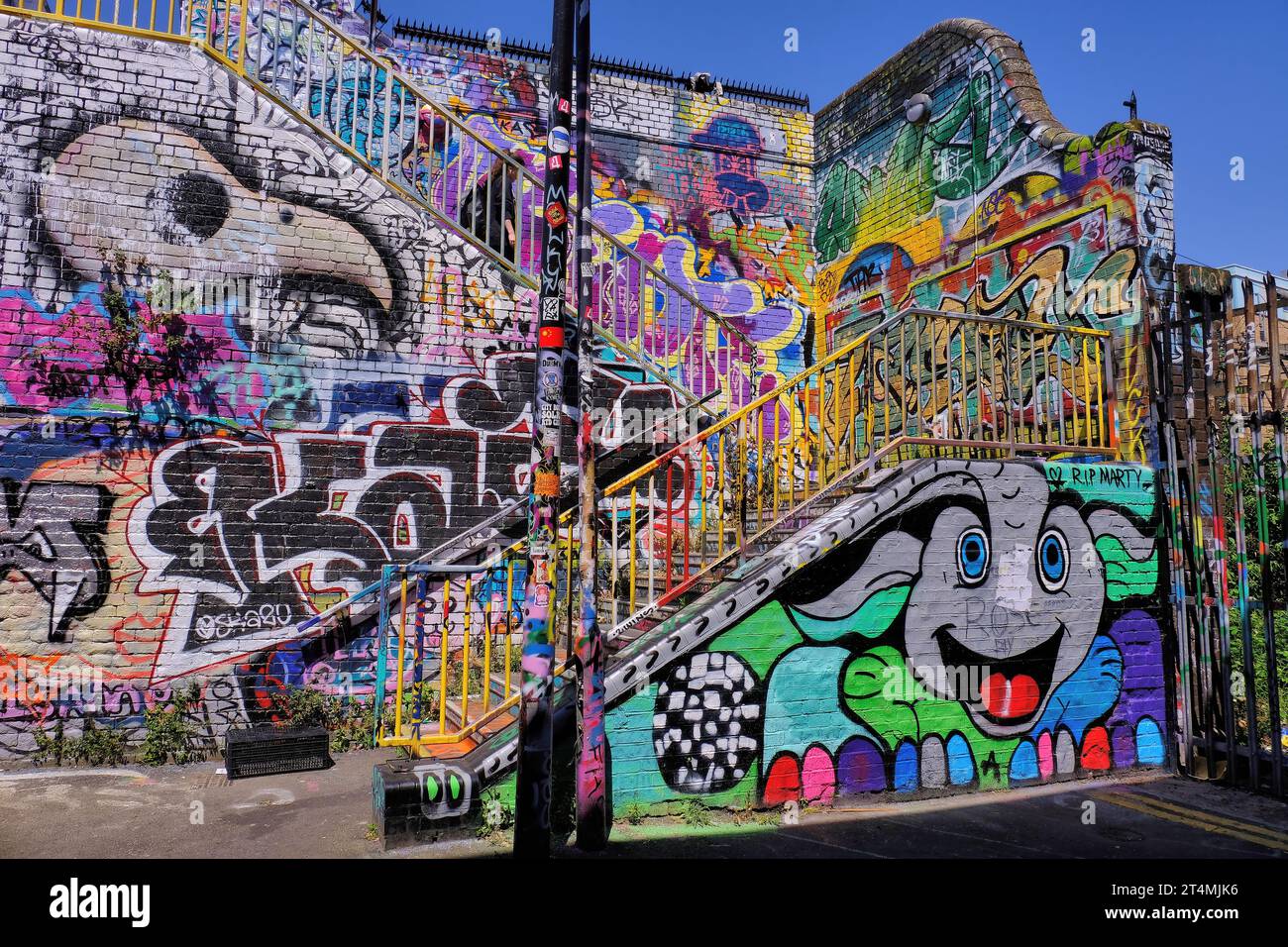 Colourful street art and graffiti in Fleet Street Hill near Brick Lane and Spitalfields, Tower Hamlets, London, England, UK Stock Photo