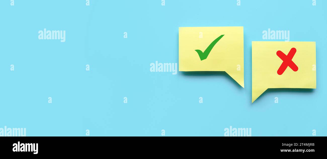 Concept of evaluation. True or false symbol. Accepted or rejected. Yes or no icon over a yellow bubble chat on blue background with copy space. Stock Photo