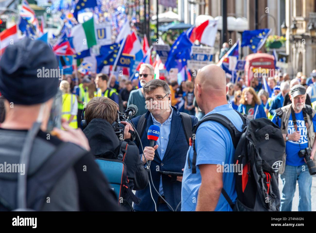 Ray Addison reporting for GB News in front of National Rejoin March II in London, UK. Protest rally campaigning for UK to re-join the European Union Stock Photo