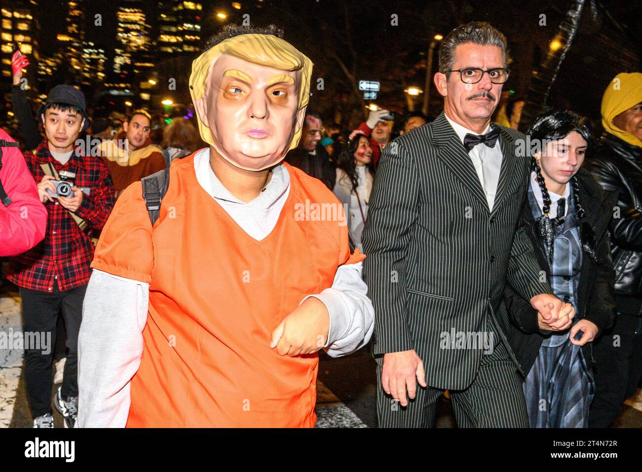 New York, USA. 31st Oct, 2023. A man wearing a mask of Donald Trump and