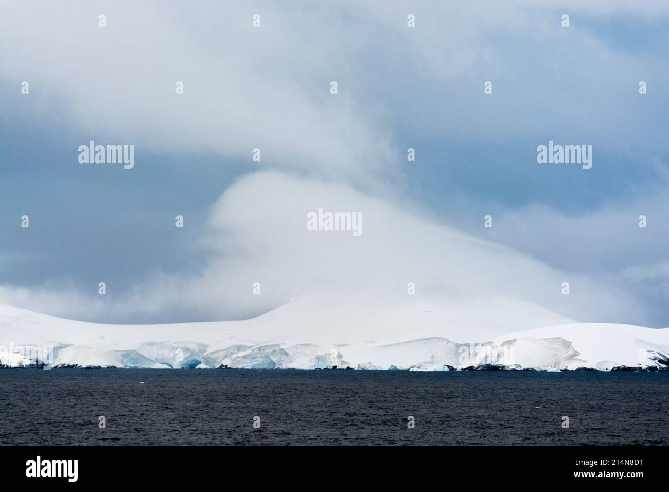 white cloud above snow covered island. antarctic peninsula. antarctica Stock Photo