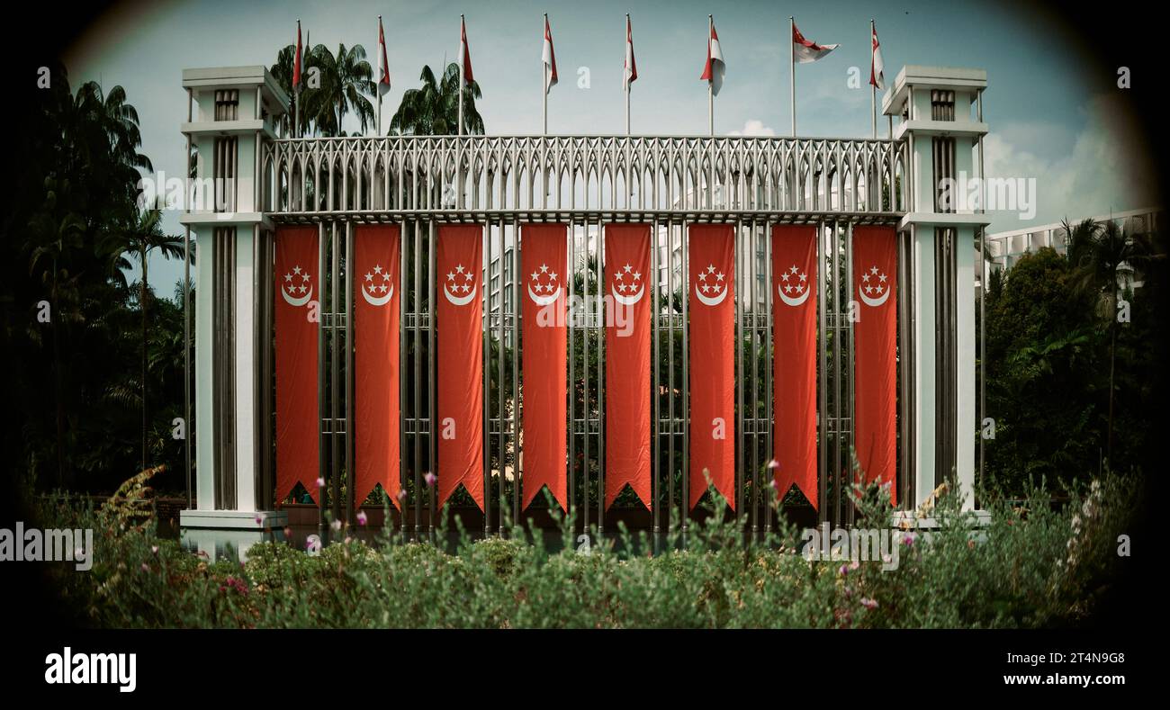Festival Arch: Singapore national flags and banners hung up in Istana Park along Orchard Road opposite Plaza Singapura to celebrate National Day Stock Photo