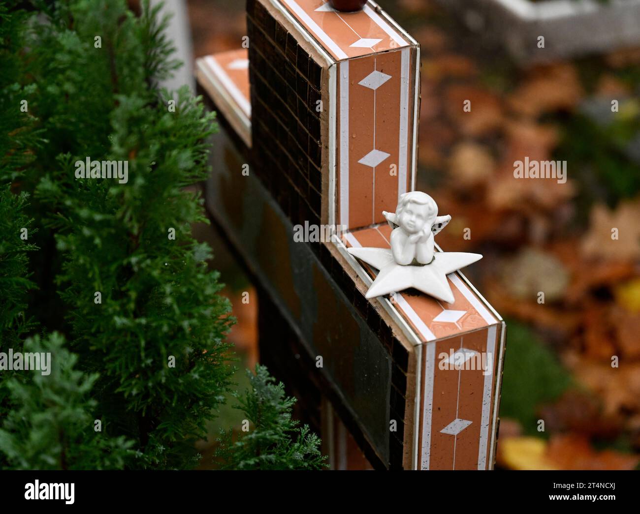 Cologne, Germany. 01st Nov, 2023. A tombstone is decorated with a figure of an angel on All Saints' Day at a grave in Melaten Cemetery. Catholics commemorate their deceased on this holiday. Credit: Roberto Pfeil/dpa/Alamy Live News Stock Photo