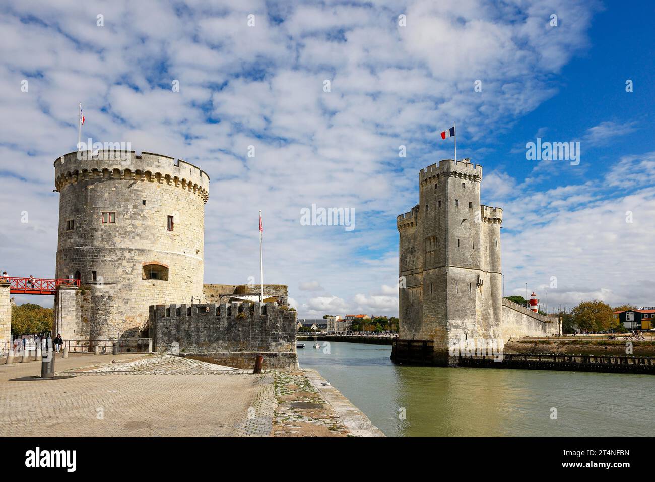 Medieval towers Tour de la Chaine warp tower (left) and Tour Saint-Nicolas, Saint-Nicolas tower guard the entrance to the old port of La Rochelle Stock Photo