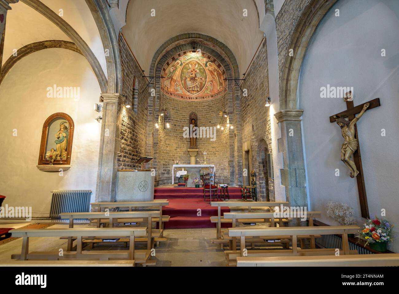 Interior of the Romanesque church of Sant Esteve de Tavèrnoles, with non-original wall paintings (Osona, Barcelona, Catalonia, Spain) Stock Photo