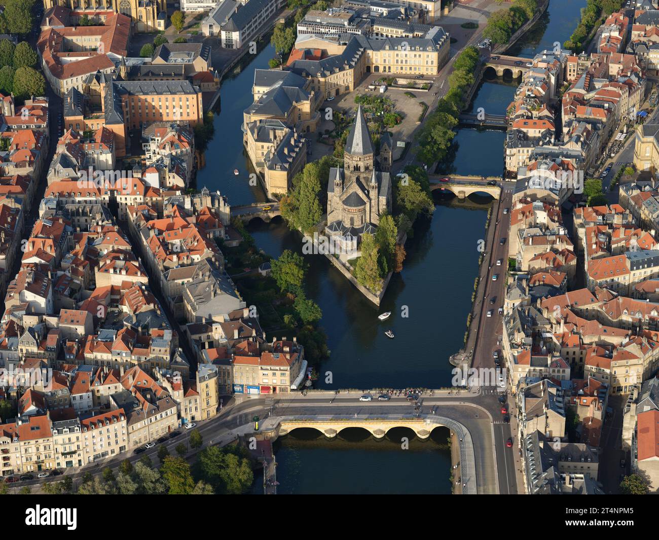 AERIAL VIEW. Petit Saulcy Island created by the Moselle River, Protestant Church at the upstream end of the island. Metz, Moselle, Grand Est, France. Stock Photo
