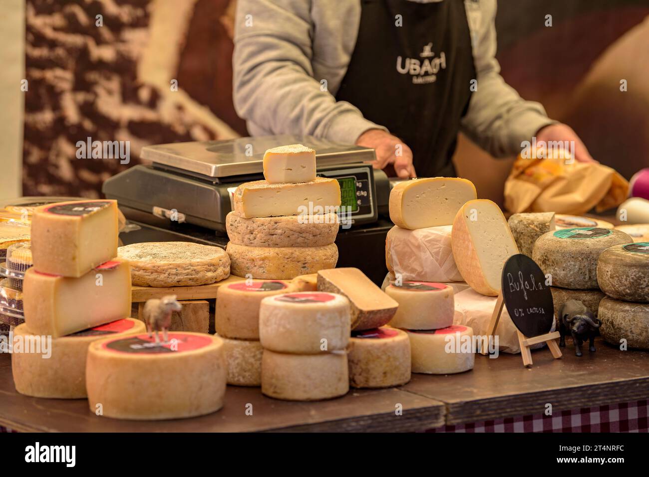 Detail of a cheese stall at the weekly market in the Plaça Major square in Vic (Osona, Barcelona, Catalonia, Spain) Stock Photo