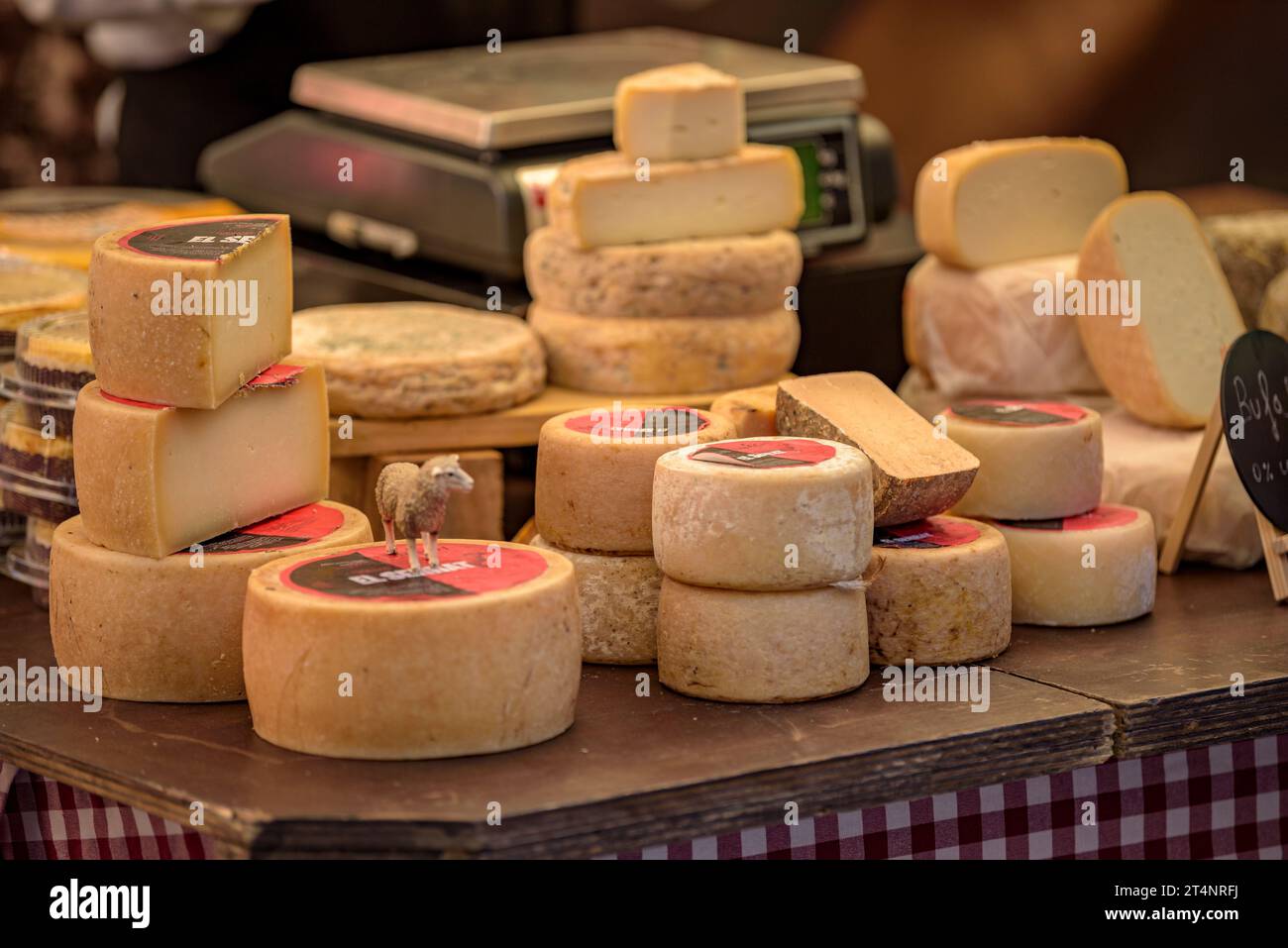 Detail of a cheese stall at the weekly market in the Plaça Major square in Vic (Osona, Barcelona, Catalonia, Spain) Stock Photo
