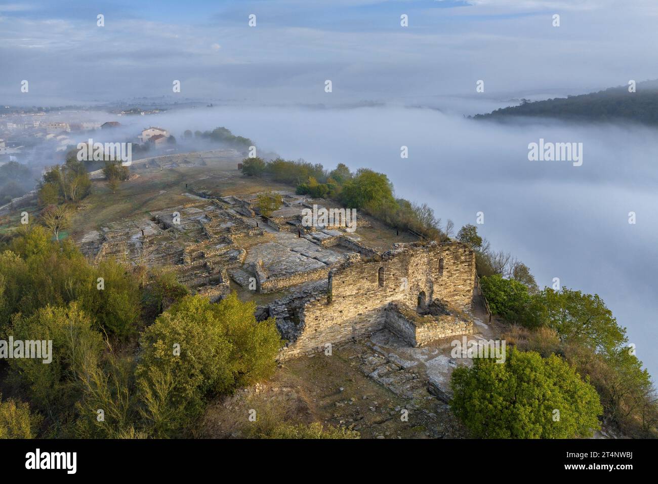 Aerial view of the archaeological site of L'Esquerda, in Roda de Ter, on a foggy sunrise (Osona, Barcelona, Catalonia, Spain) Stock Photo