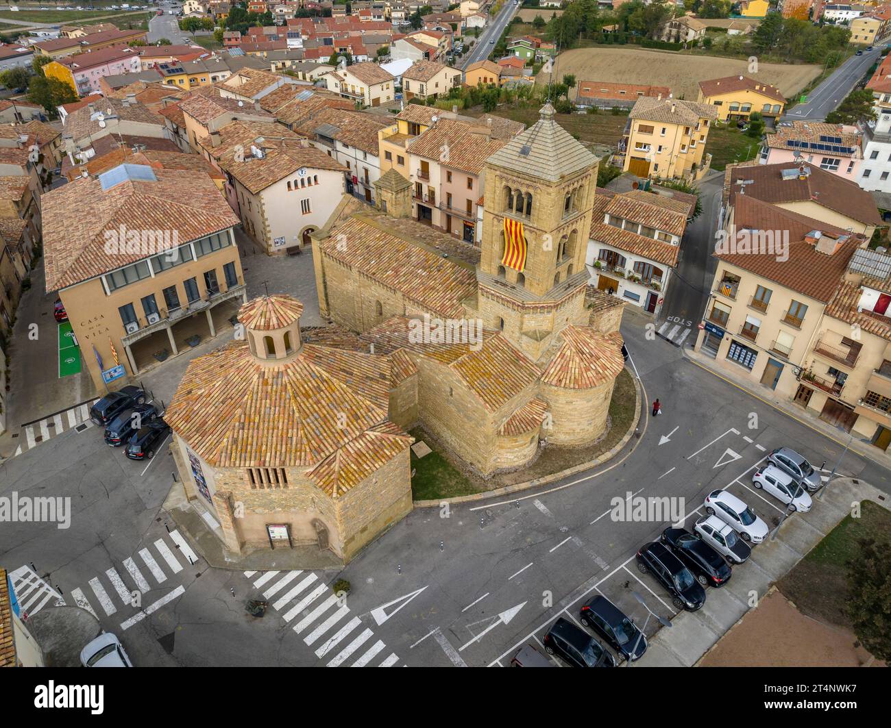 Aerial view of the town and the Romanesque church of Santa Eugènia de Berga, in La Plana de Vic (Osona, Barcelona, Catalonia, Spain) Stock Photo