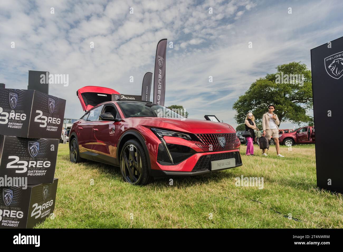 Nantwich, Cheshire, England, July 26th 2023. Red Peugeot 408 at an event display, automotive lifestyle editorial illustration. Stock Photo