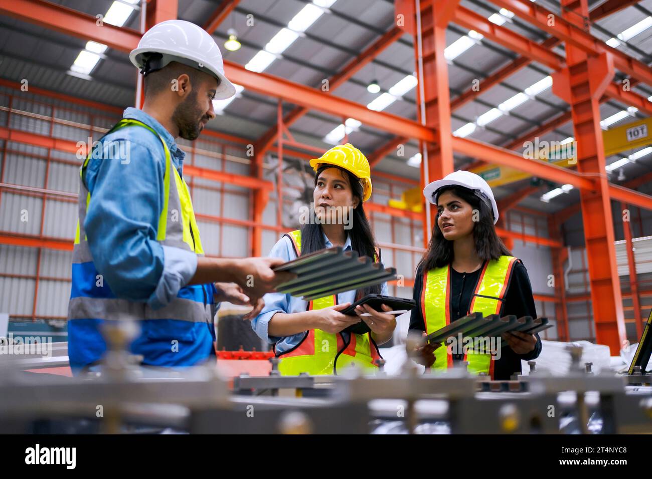 Blue collar worker work at metal sheet factory. Blue collar worker and