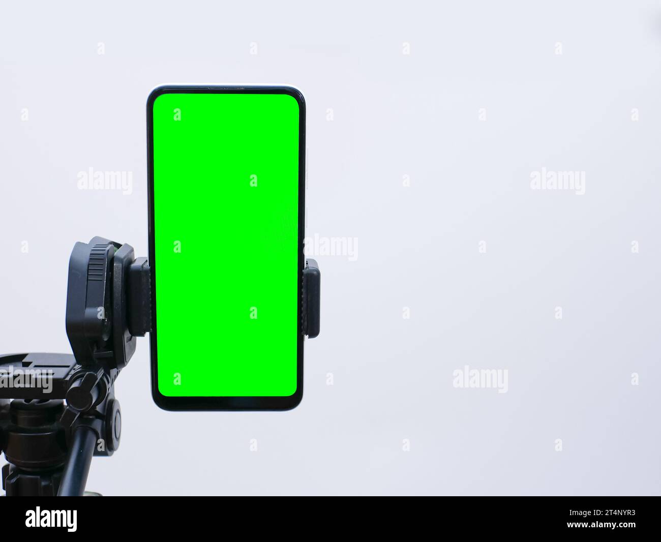 smartphone with green screen on tripod holder. smartphone mock up with ...