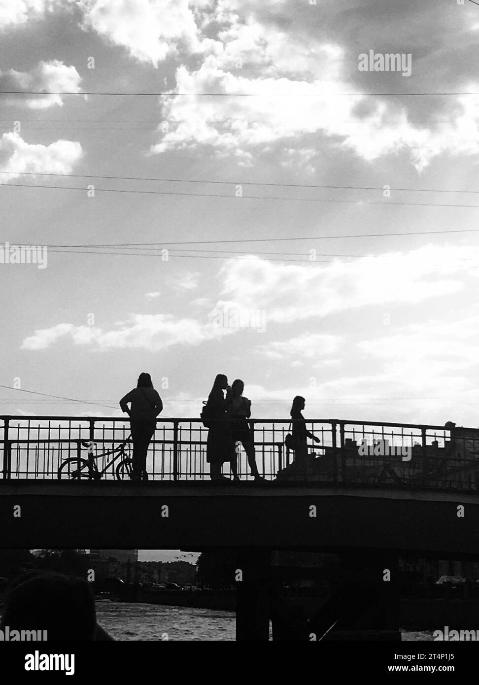 ST. PETERSBURG, RUSSIA, JUNE, 20, 2014. black and white photo of a bridge with people standing on it Stock Photo